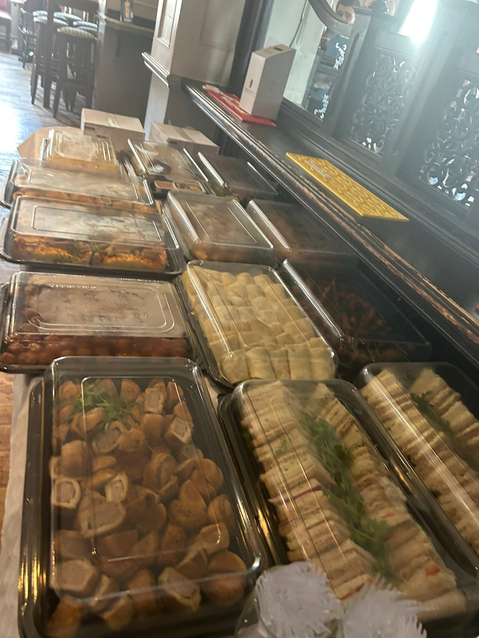 Large Platter Offer — rows of covered trays with sandwiches, sausage rolls, wraps and more