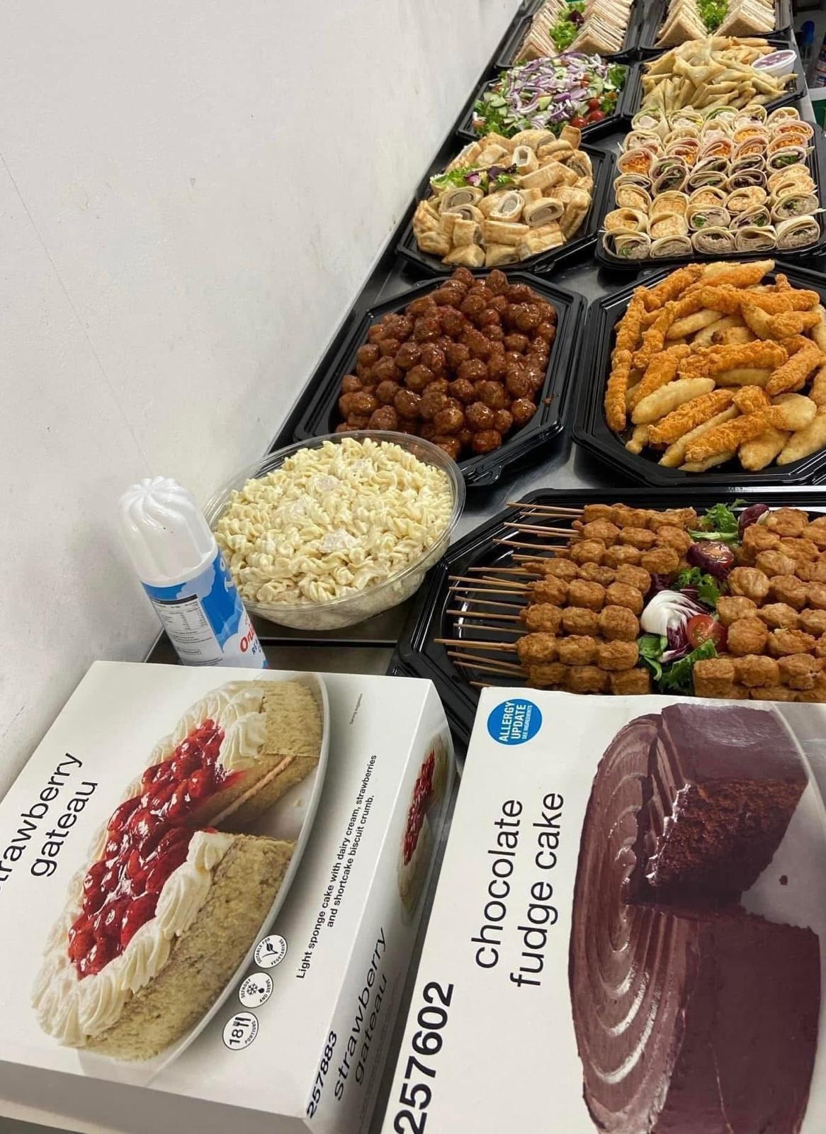 Platter Offer — meatballs, chicken strips, satay skewers, pasta, wraps, salad, strawberry gateau and chocolate fudge cake