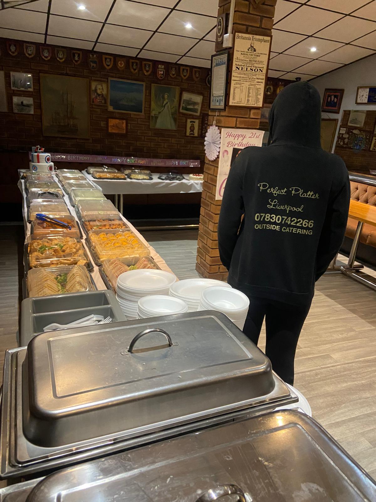 Perfect Platter Liverpool — branded team setting up a long buffet table for a 21st birthday